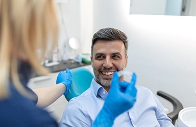 man visiting orthodontist for Invisalign 